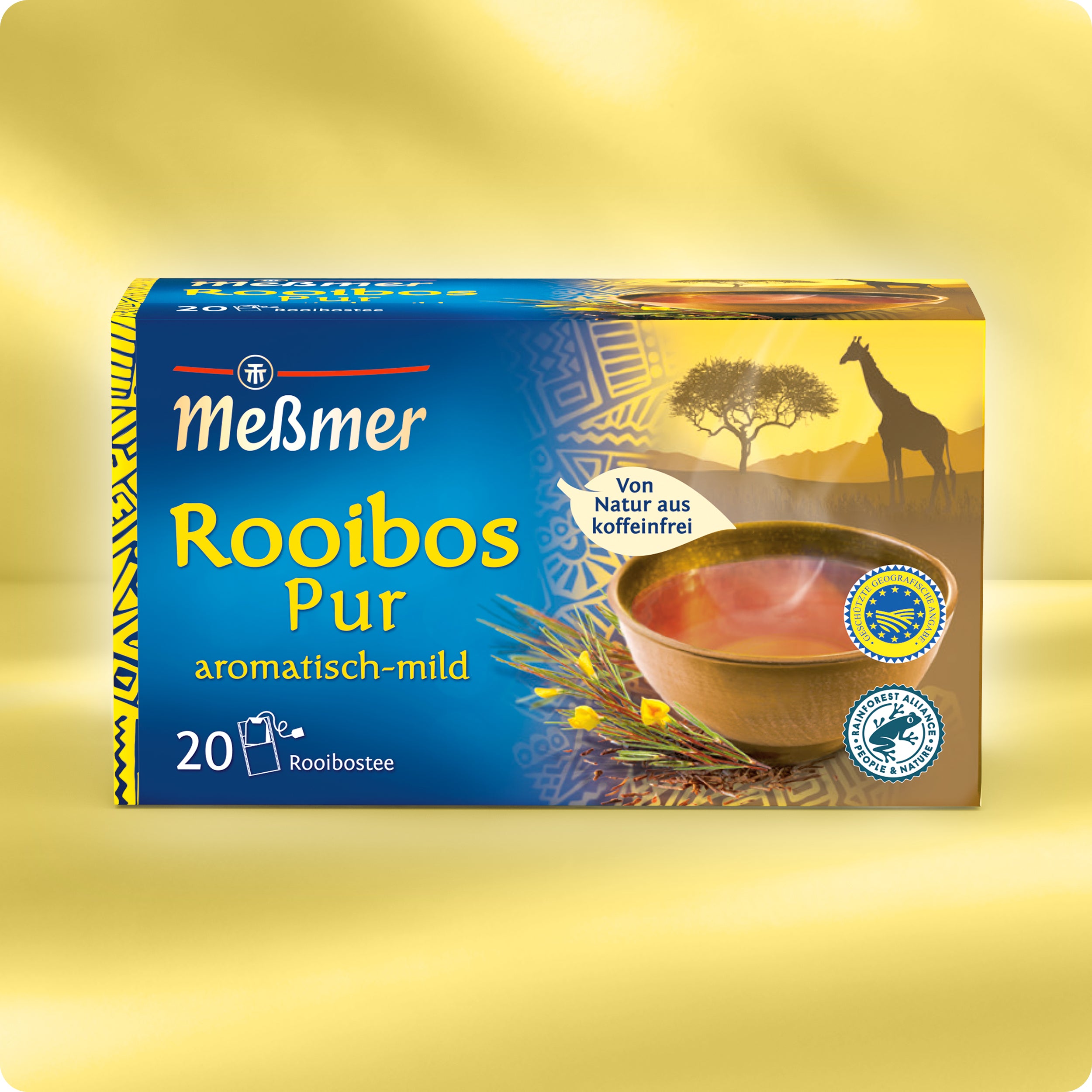 Eine Schachtel Meßmer DE Rooibos pur Tee mit einem gelb-blauen Design, das eine Tasse Tee, eine Rooibos-Pflanze und die Silhouette einer Giraffe zeigt, mit der Aufschrift koffeinfrei und Südafrika-inspiriert, enthält 20 Teebeutel.