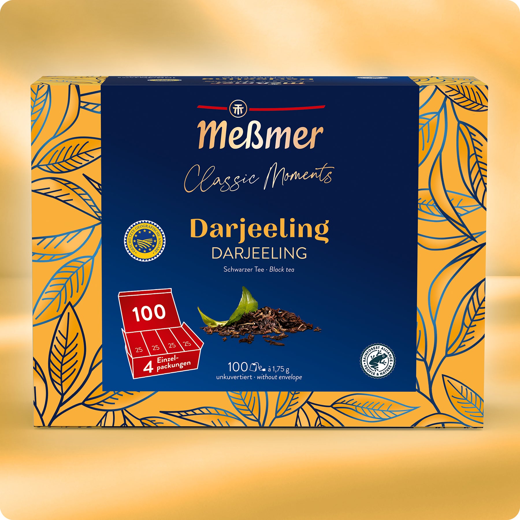Eine Schachtel Meßmer DE Darjeeling-Tee in blau-goldenem Design mit Blattakzenten zeigt auf der Vorderseite den Text für 100 Teebeutel und ein Bild von losen Teeblättern.