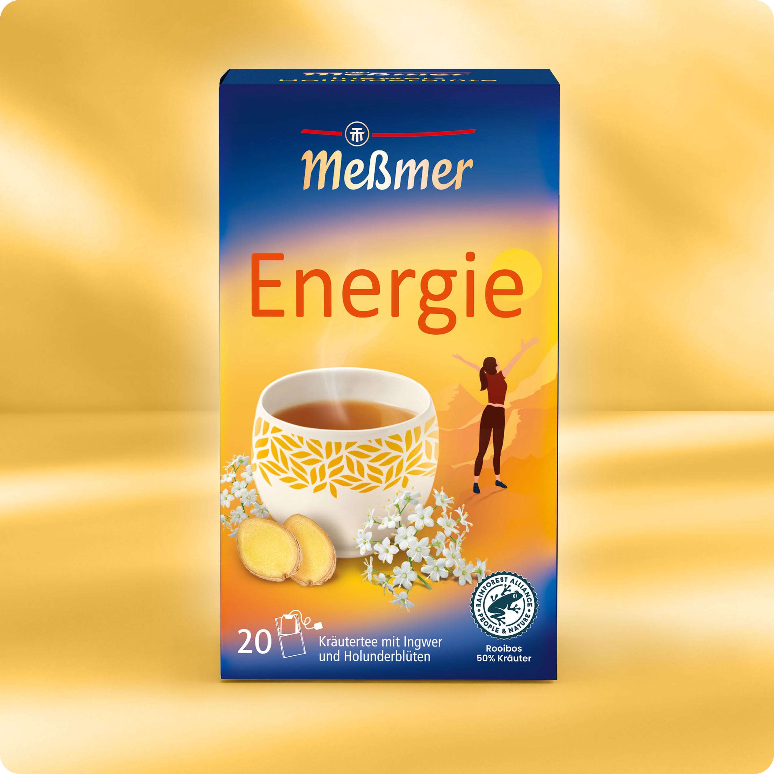 Meßmer DE Energie Kräuterteedose, mit einer Tasse Tee, Ingwerscheiben und Holunderblüten auf der Vorderseite. Der Hintergrund zeigt einen Sonnenaufgang mit einer sich reckenden Person in Gelb- und Blautönen.
