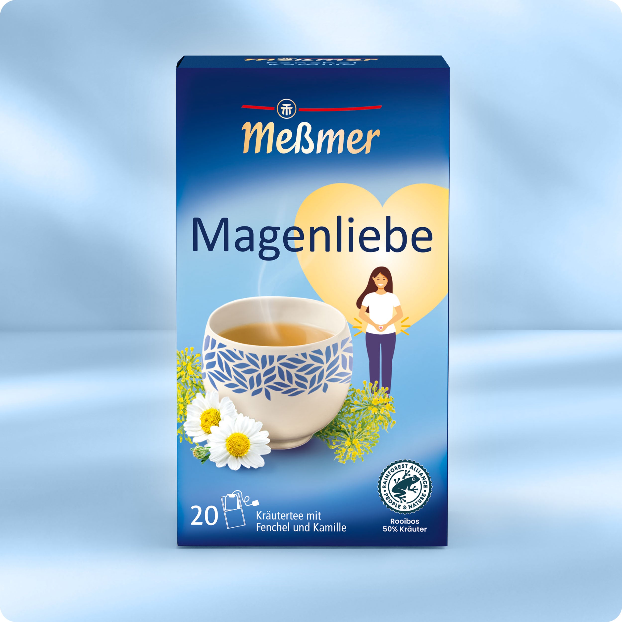 Eine blaue Meßmer DE Magenliebe Kräuterteedose zeigt eine Teetasse, Fenchel- und Kamillenblüten, ein Herz und eine illustrierte Frau auf der Vorderseite. Diese Kräutermischung enthält 20 Teebeutel.