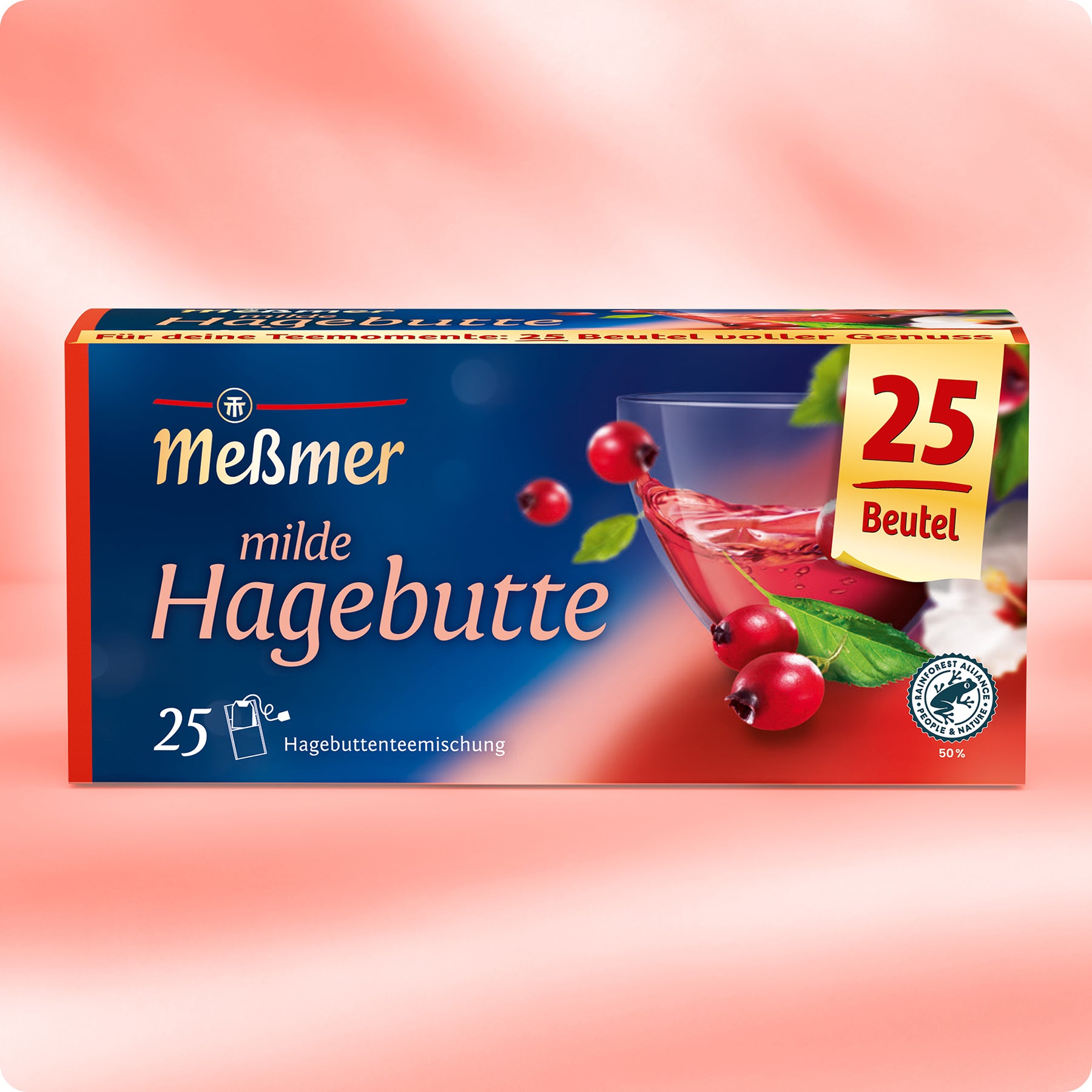 Eine Schachtel Meßmer DE milde Hagebutte Tee mit 25 Beuteln. Die Verpackung zeigt ein Glas Hagebuttentee, Hagebutten und grüne Blätter auf einem rot-blauem Farbverlauf.