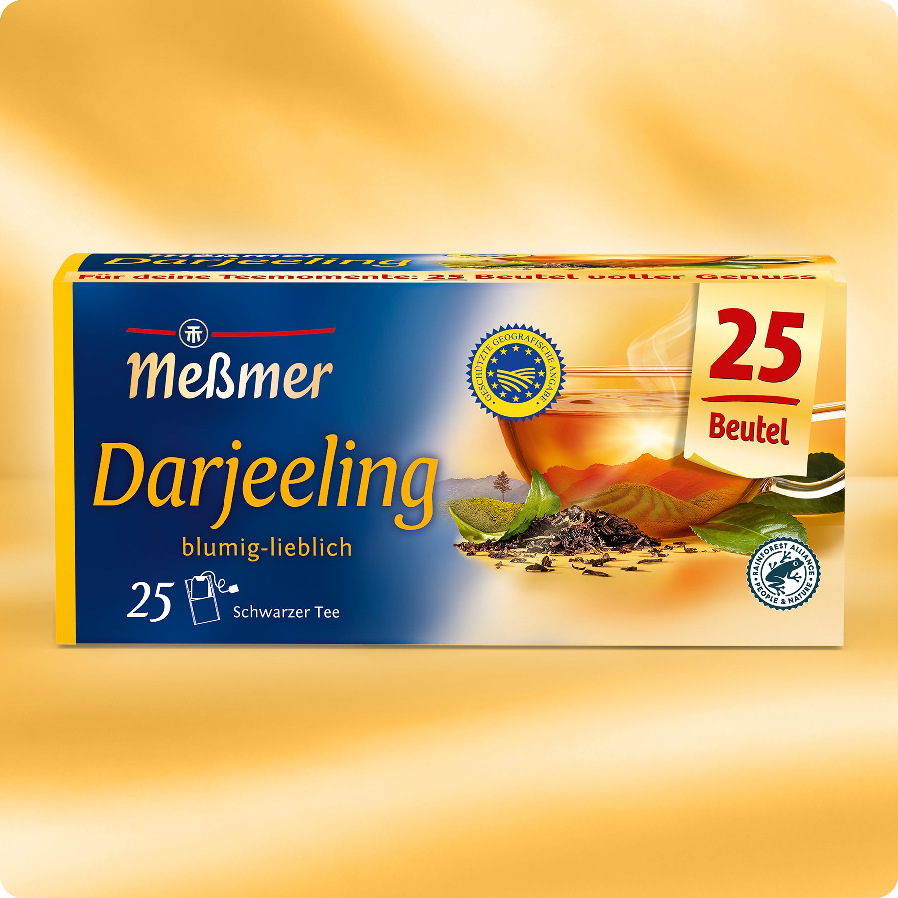 Eine Schachtel Meßmer DE Darjeeling mit 25 Teebeuteln, die eine Tasse Tee, Teeblätter und "blumig-lieblich" auf einem blau-goldenen Hintergrund zeigt.