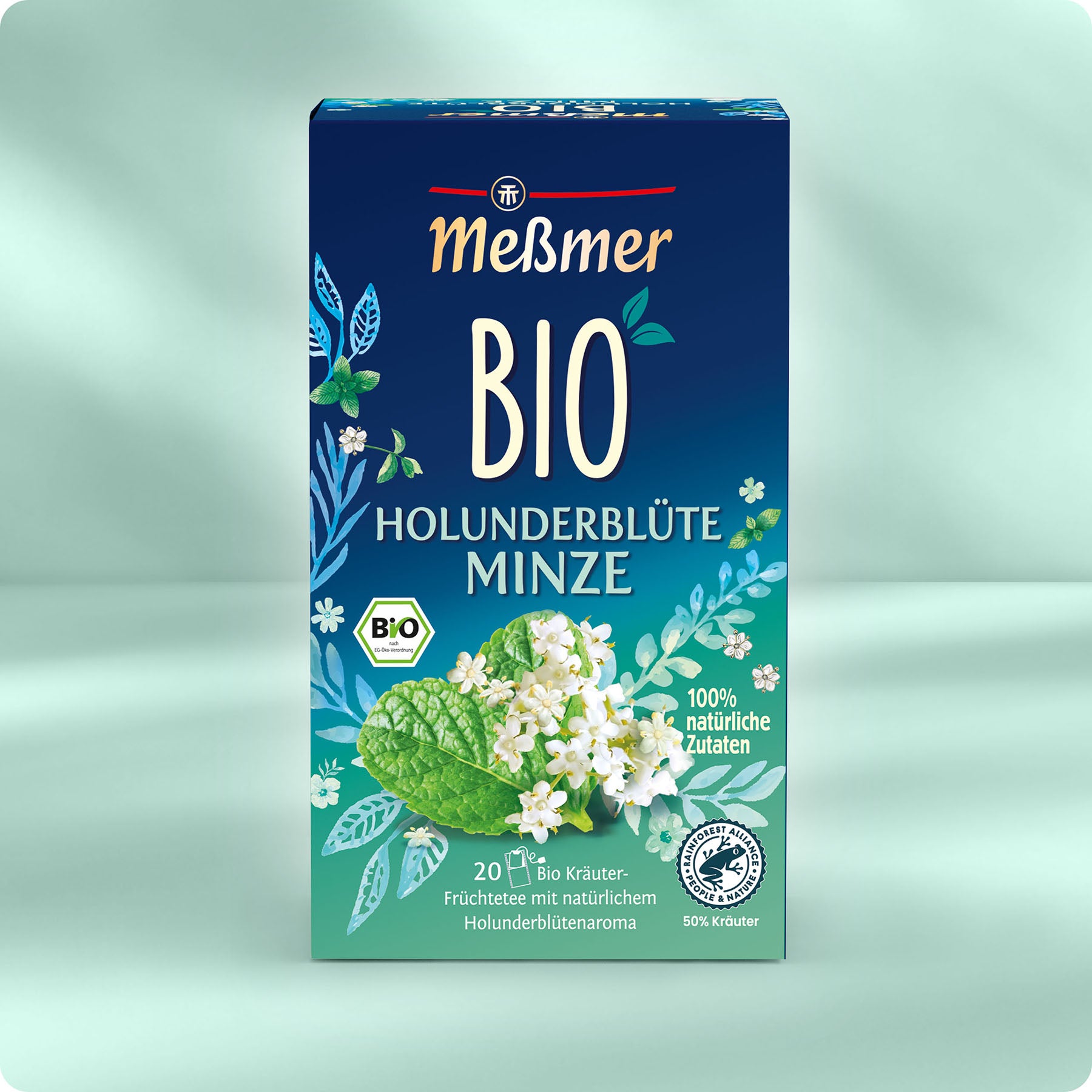 Die blau-grüne Dose Meßmer DE Bio Holunderblüte Minze Tee mit Holunderblüten und Minzblättern sorgt für ein erfrischendes Erlebnis. Die Bio-Verpackung enthält 20 Teebeutel mit ausschließlich natürlichen Zutaten.